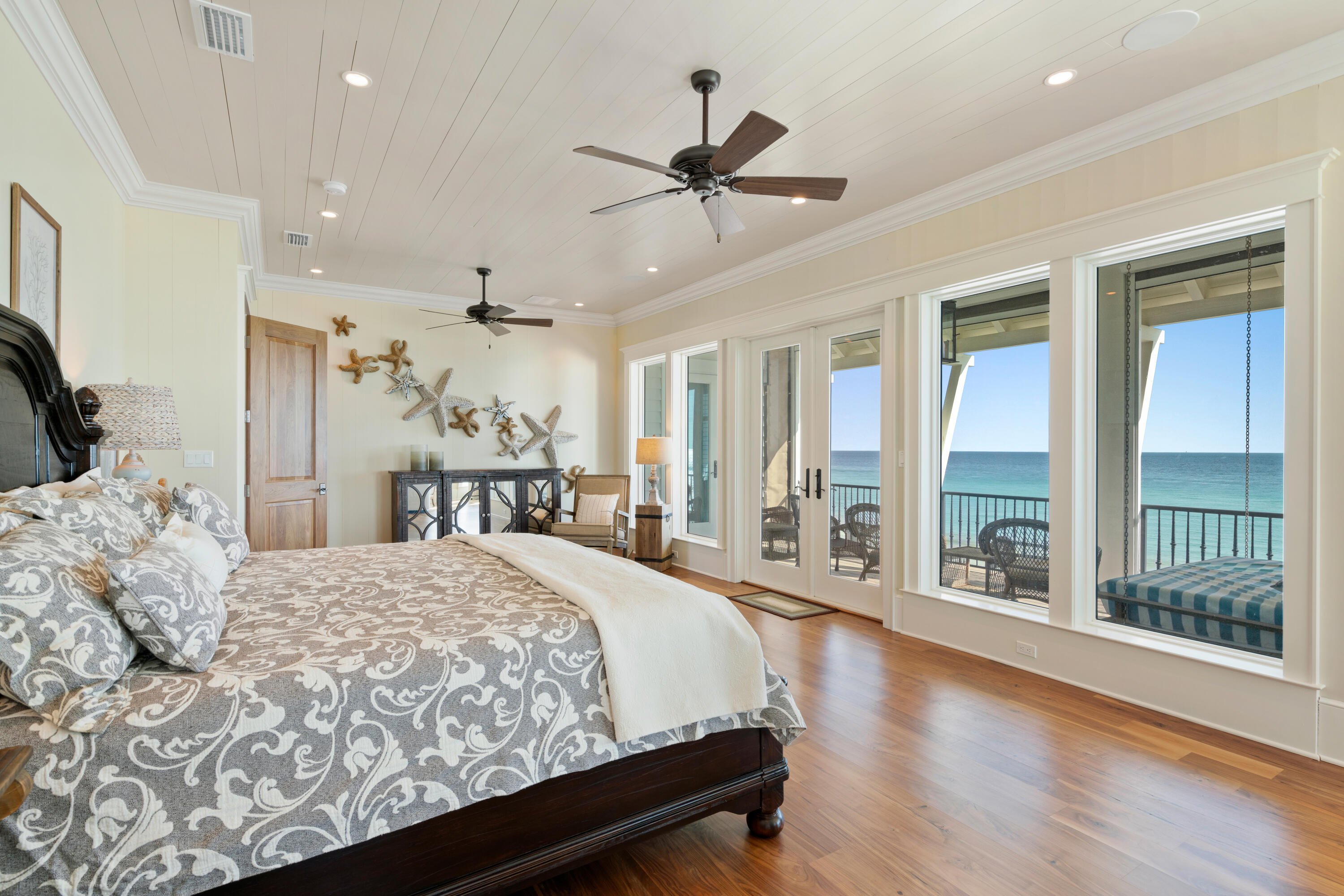 556 Blue Mountain Road Santa Rosa Beach, FL 32459 - Photo 49 of 72 a spacious bedroom with a large bed and a large window