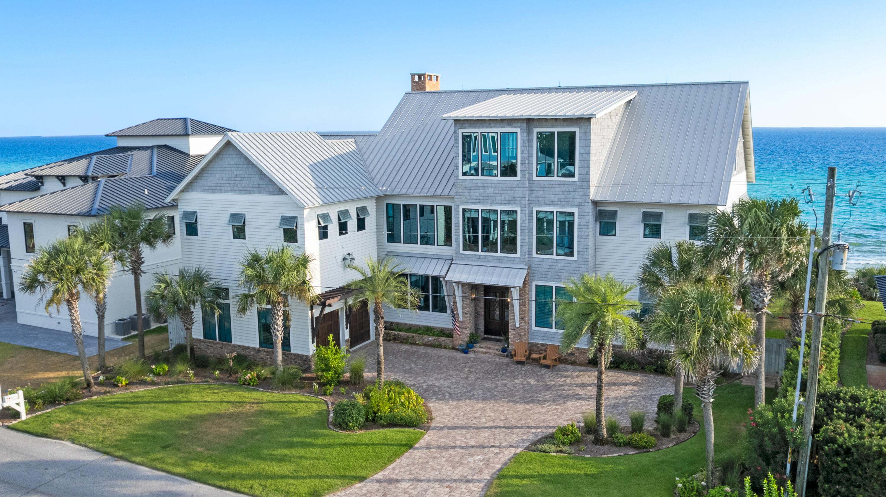556 Blue Mountain Road Santa Rosa Beach, FL 32459 - Photo 5 of 72 a front view of a house with a garden