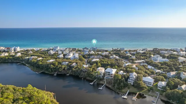 a front view of a house with a yard table and chairs