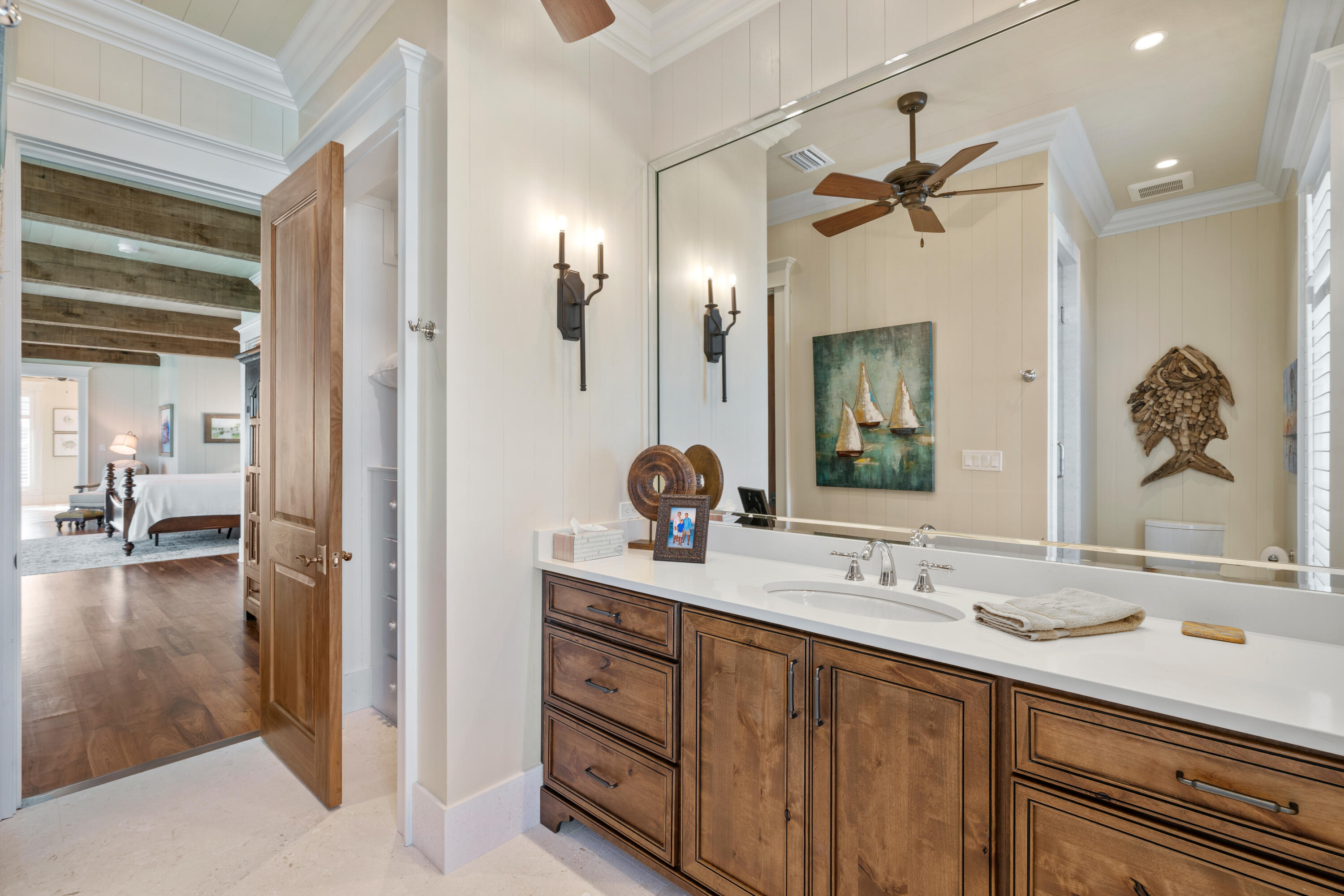556 Blue Mountain Road Santa Rosa Beach, FL 32459 - Photo 63 of 72 a en suite bathroom with a double vanity sink and a mirror