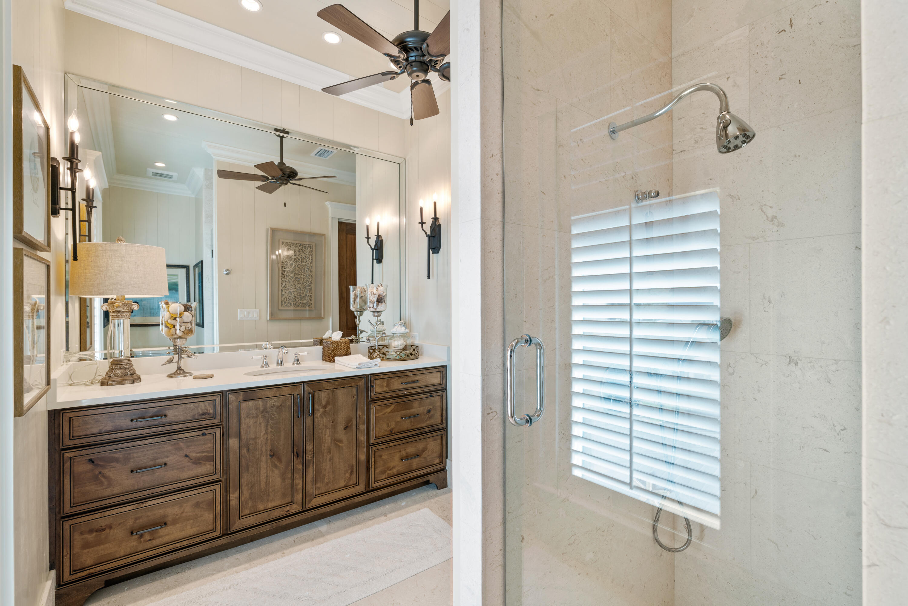 556 Blue Mountain Road Santa Rosa Beach, FL 32459 - Photo 65 of 72 a bathroom with a double vanity sink and mirror with shower