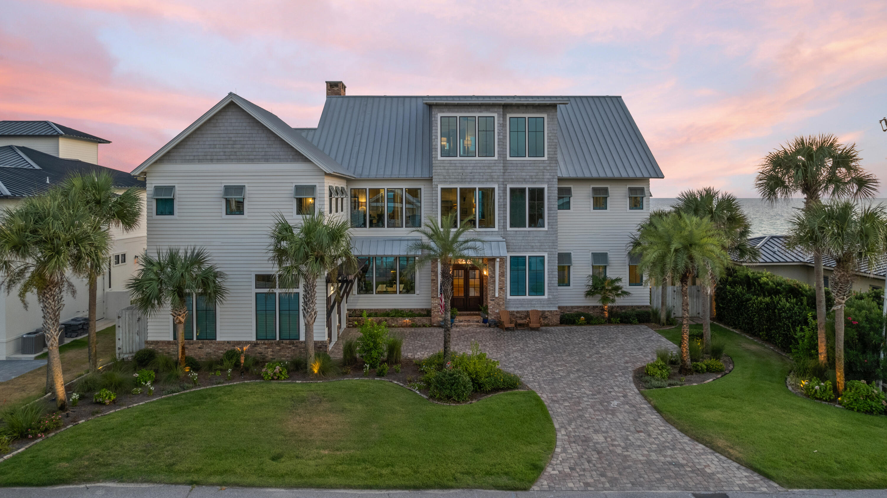 556 Blue Mountain Road Santa Rosa Beach, FL 32459 - Photo 71 of 72 a front view of a house with a yard and trees