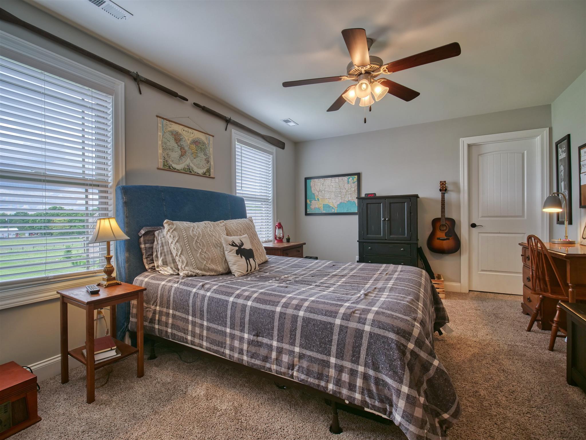 9590 Mona Road Murfreesboro, TN 37129 - Photo 24 of 30 a bedroom with a bed and a chandelier