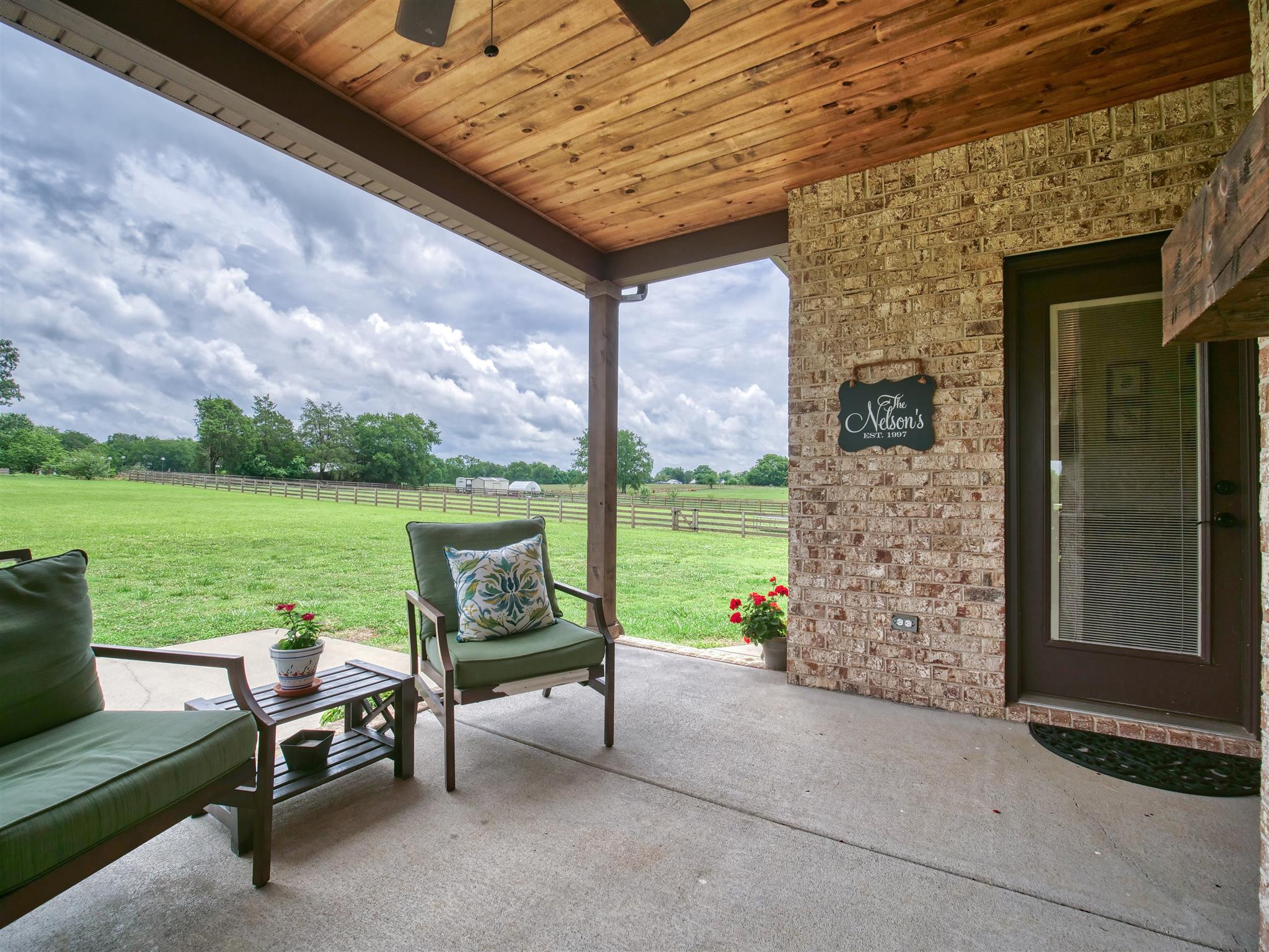 9590 Mona Road Murfreesboro, TN 37129 - Photo 5 of 30 a view of a patio with lawn chairs next to a yard