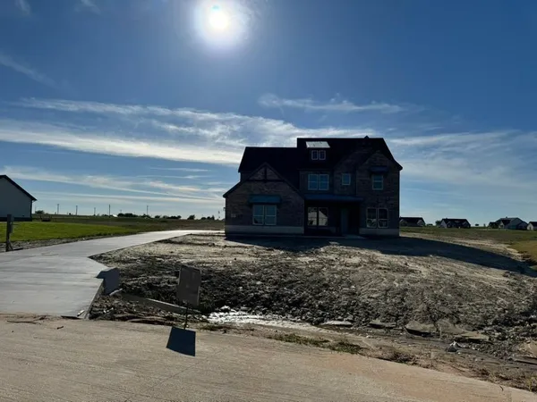 a view of a terrace with a wooden fence