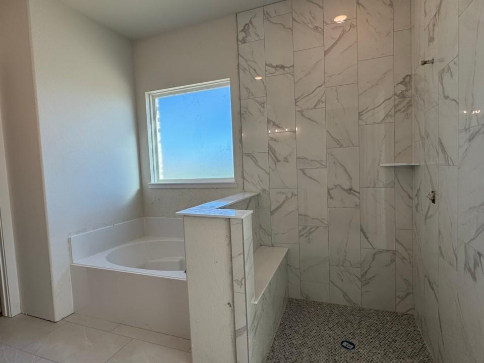 2209 Continent Court Krum, TX 76249 - Photo 13 of 24 a bathroom with a bathtub