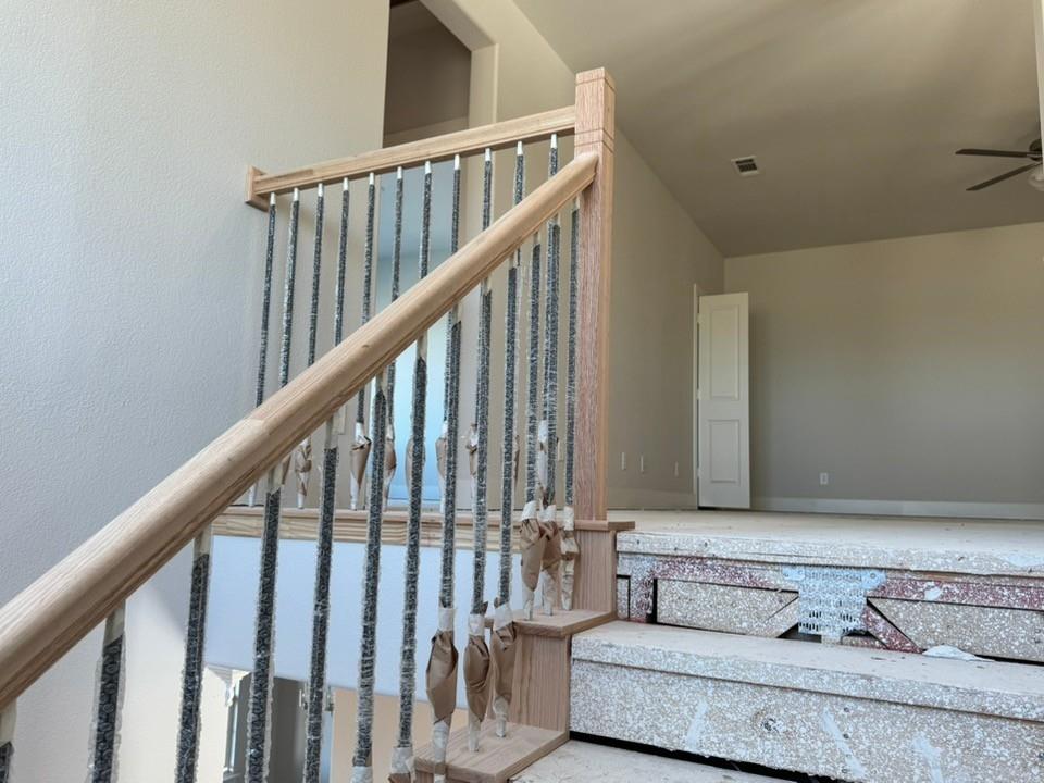 2209 Continent Court Krum, TX 76249 - Photo 16 of 24 a bedroom with furniture and stairs