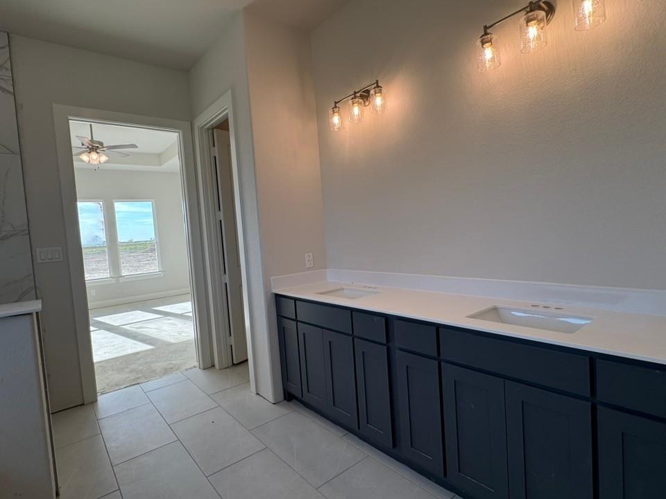 2209 Continent Court Krum, TX 76249 - Photo 17 of 24 a room with a wooden floor and staircase
