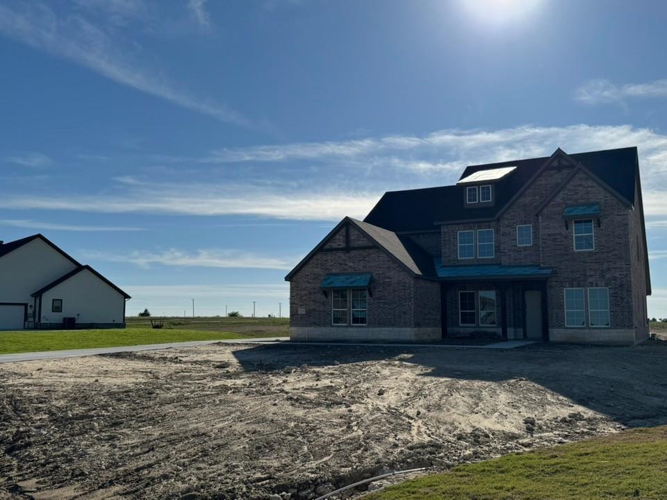 2209 Continent Court Krum, TX 76249 - Photo 3 of 24 a view of a house with a yard