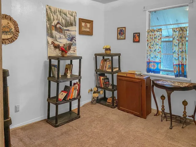 a bedroom with a bed and flat screen tv