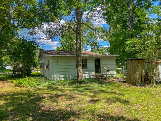 a view of outdoor space with deck and yard