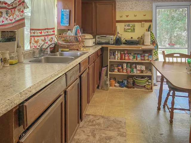 a view of a dining room with furniture window and outside view