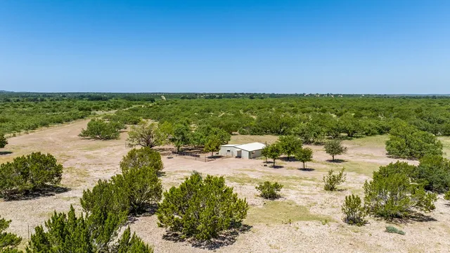 a view of a lake with a yard