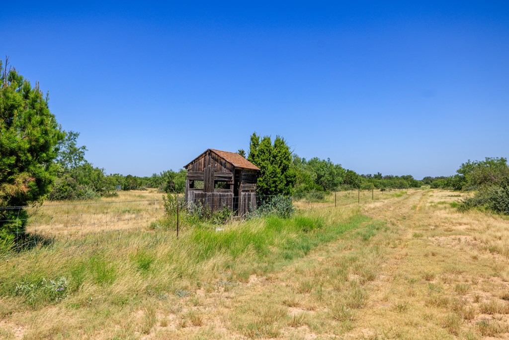 16251 Door Key Road San Angelo, TX 76904 - Photo 41 of 69 a view of a lake with a yard