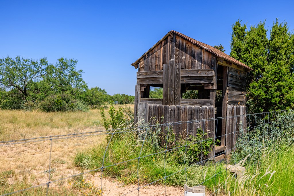 16251 Door Key Road San Angelo, TX 76904 - Photo 42 of 69 a front view of a house with a yard