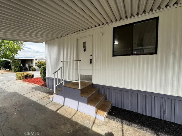 a view of a living room and a balcony