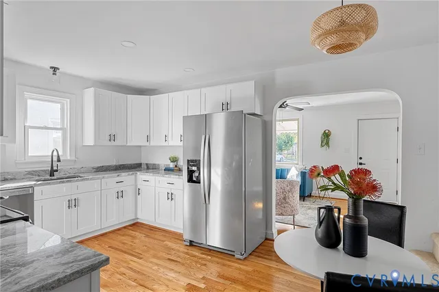a kitchen with a sink and refrigerator