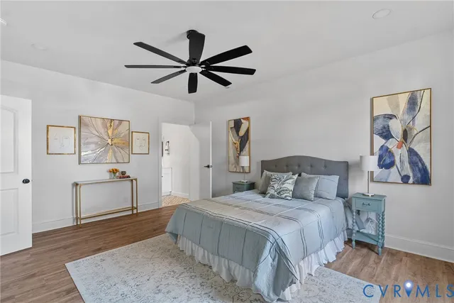 a bedroom with a bed and a dresser