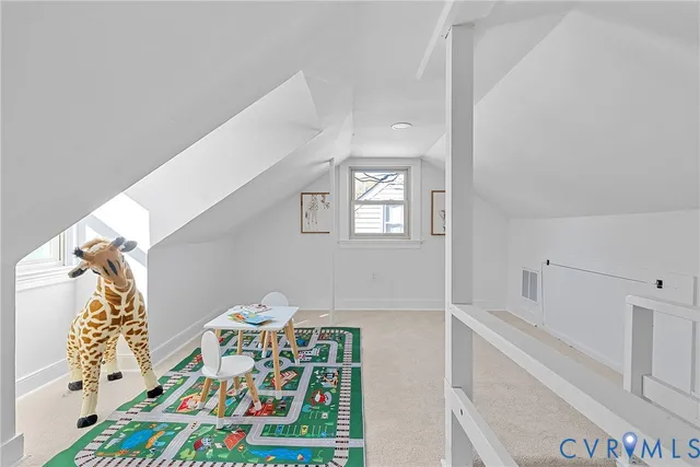 a bathroom with a sink mirror and vanity