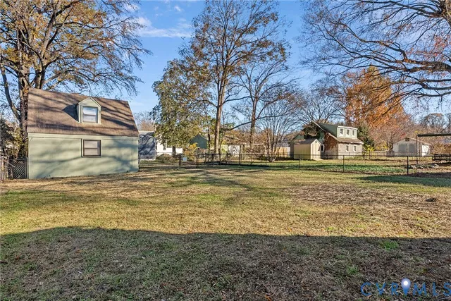 a view of road with large trees