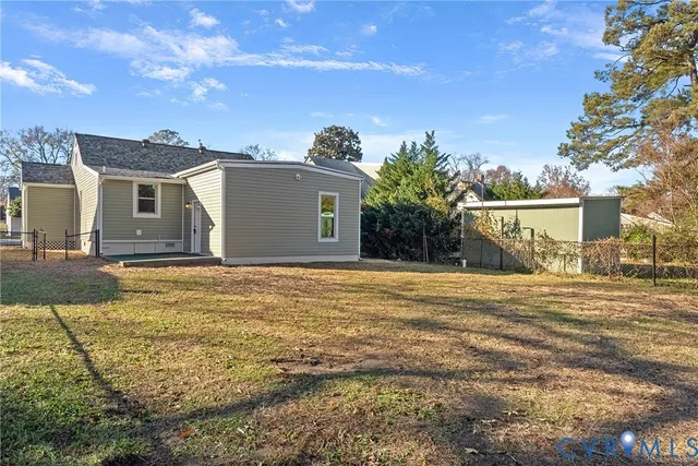 a view of a house with a yard and garage
