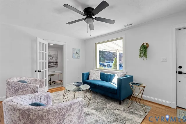 a living room with furniture and a window
