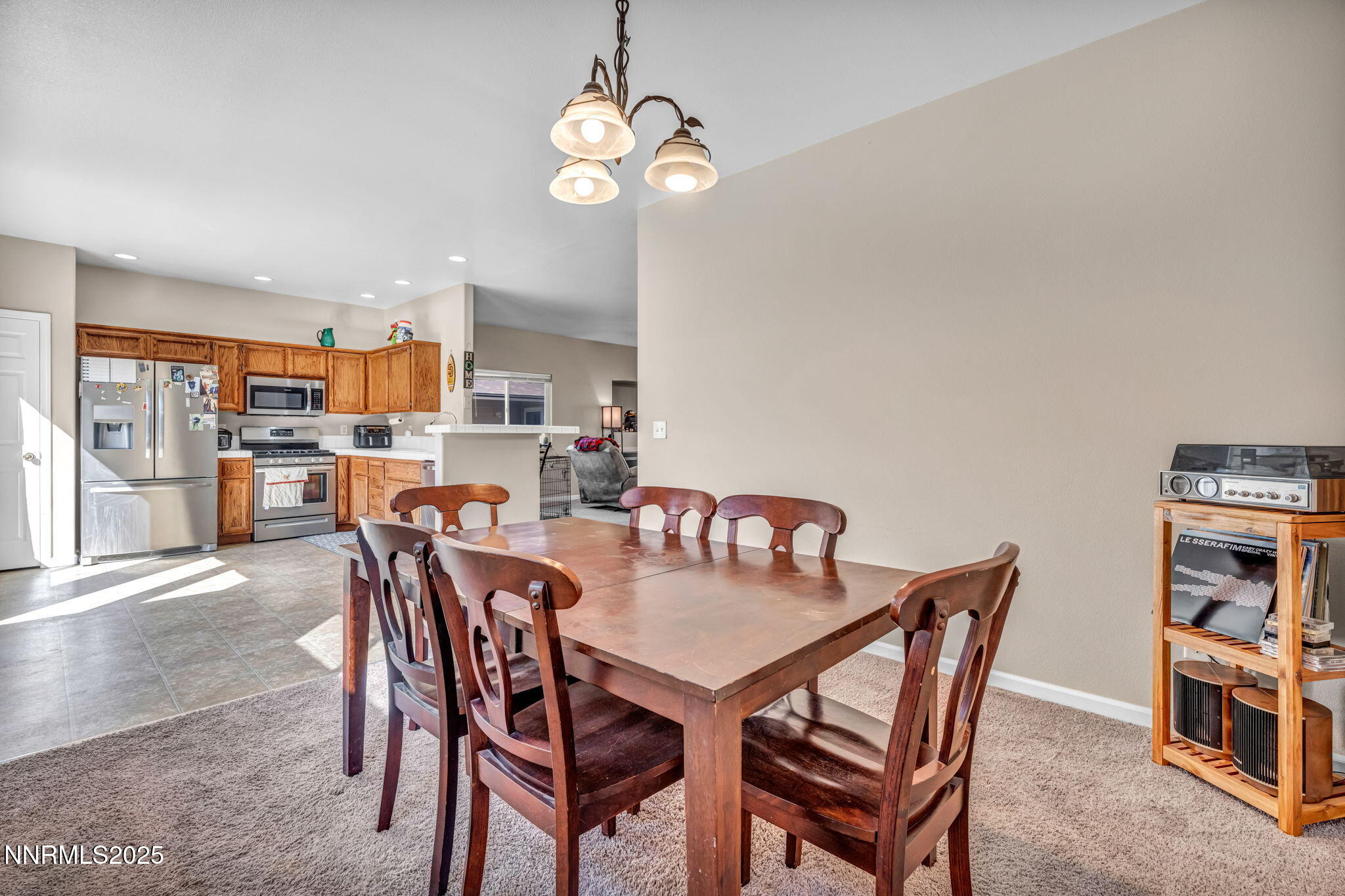 1295 Eider Circle Fallon, NV 89406 - Photo 14 of 37 a view of a dining room with furniture and a chandelier