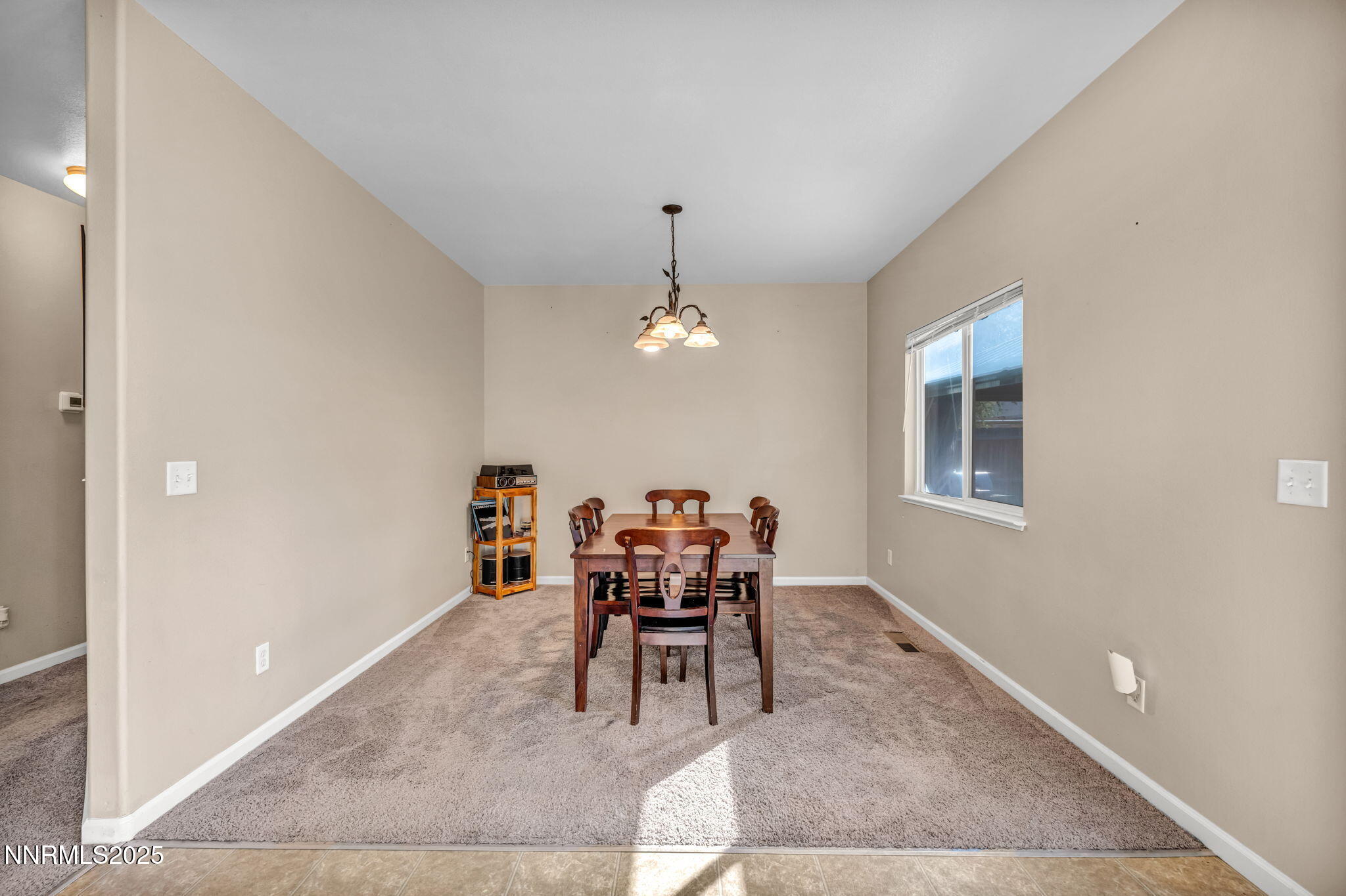1295 Eider Circle Fallon, NV 89406 - Photo 15 of 37 a dining room with a table and chairs
