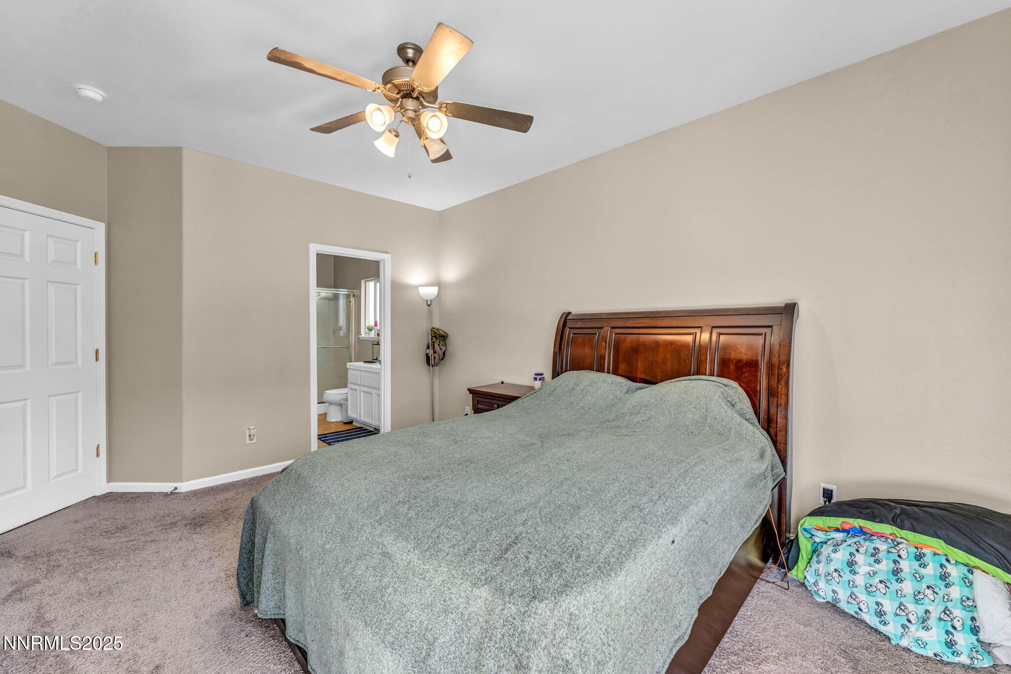 1295 Eider Circle Fallon, NV 89406 - Photo 23 of 37 a bedroom with a bed and a chandelier