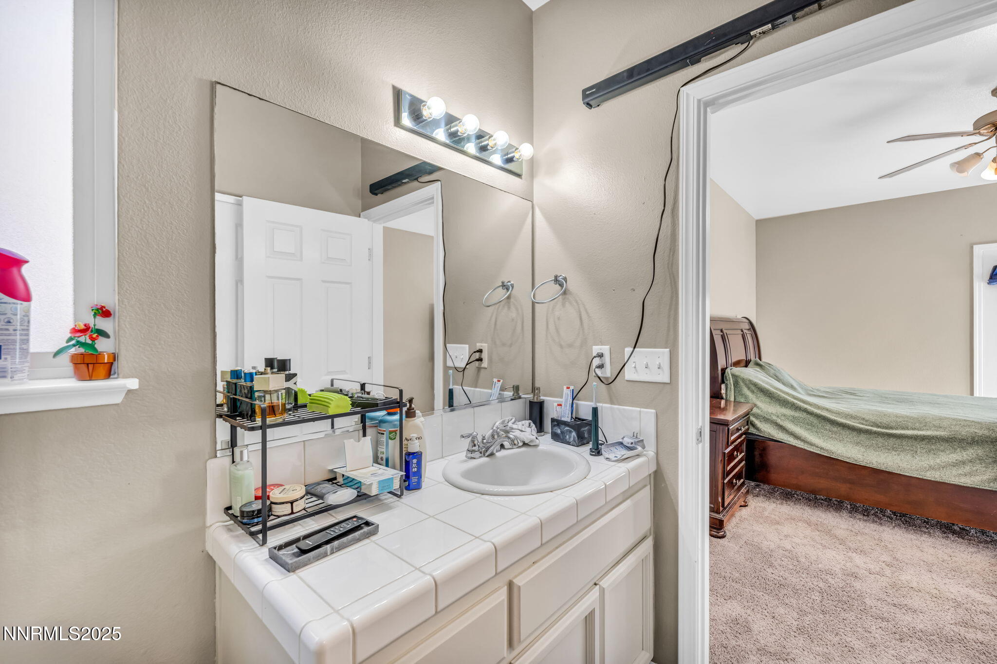 1295 Eider Circle Fallon, NV 89406 - Photo 25 of 37 a bathroom with a sink double vanity and a mirror