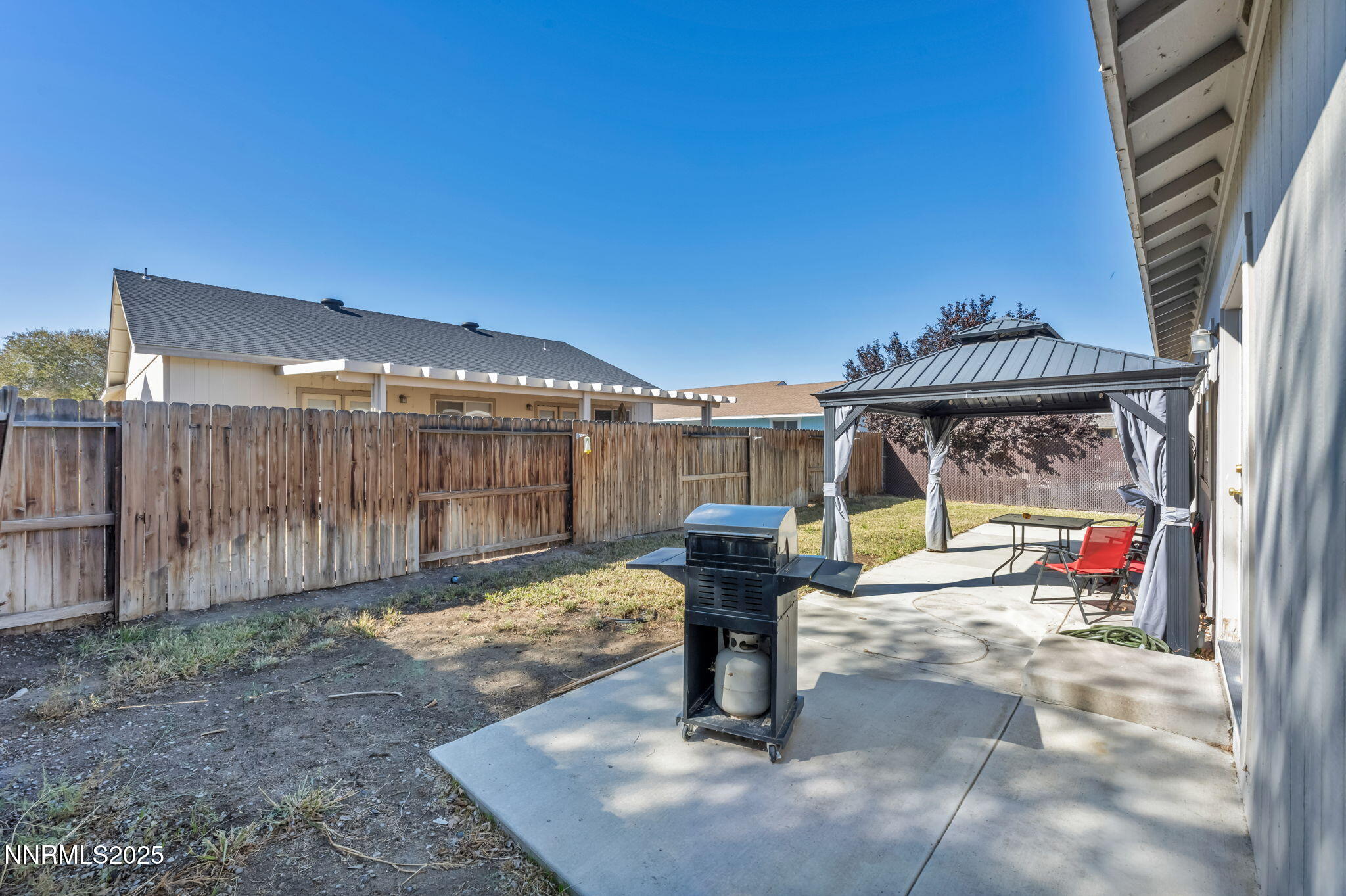 1295 Eider Circle Fallon, NV 89406 - Photo 34 of 37 a view of a porch with furniture and floor to ceiling window