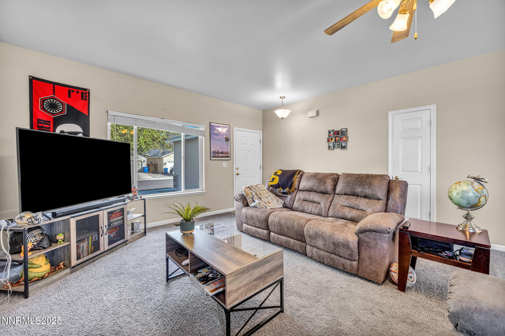 1295 Eider Circle Fallon, NV 89406 - Photo 5 of 37 a living room with furniture and a flat screen tv