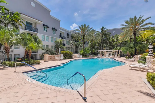 a view of a swimming pool with a lounge chairs