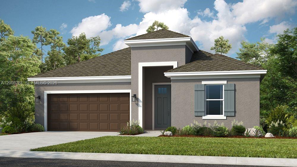 653 Southeast Ranch Oak Circle Port St. Lucie, FL 34984 - Photo 1 of 43 a front view of a house with a yard and garage