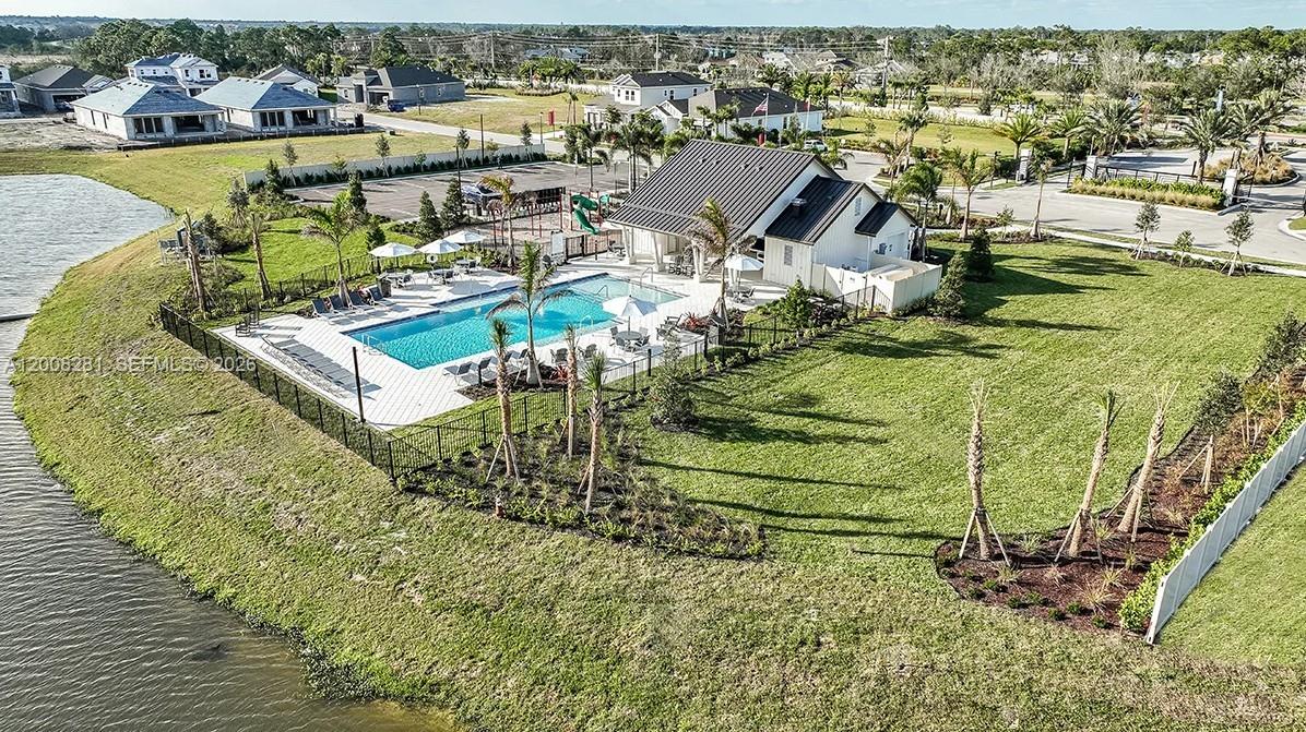 653 Southeast Ranch Oak Circle Port St. Lucie, FL 34984 - Photo 32 of 43 an aerial view of a house with a ocean view