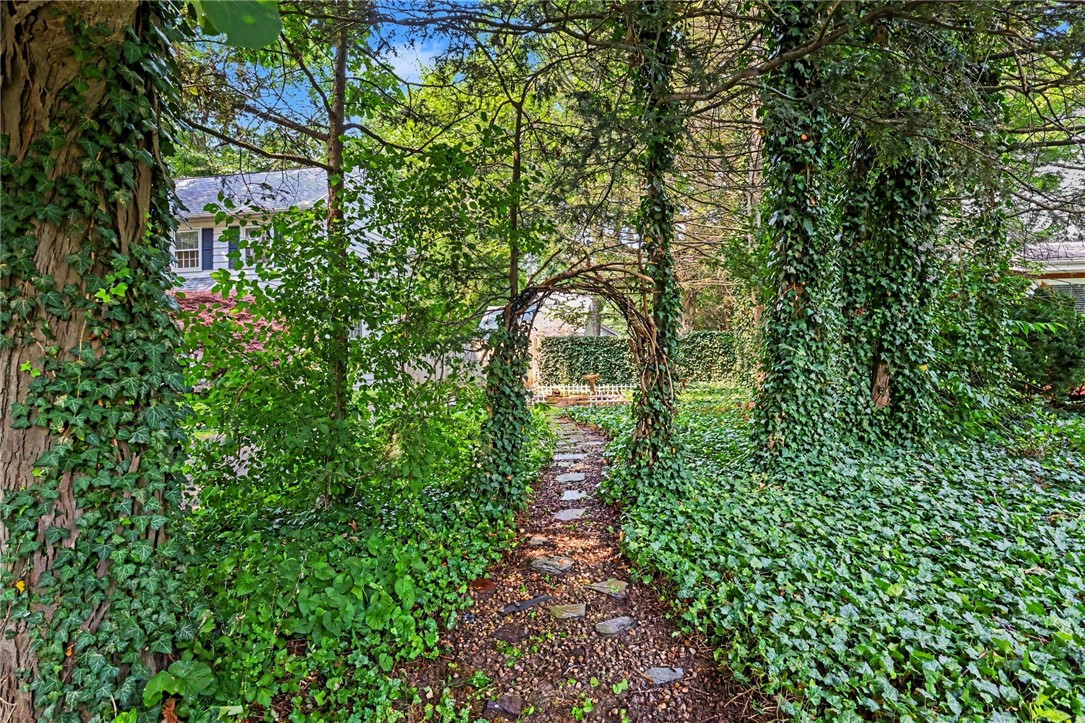 374 Ashbourne Road Brighton, NY 14618 - Photo 26 of 33 Path leading to side garden.