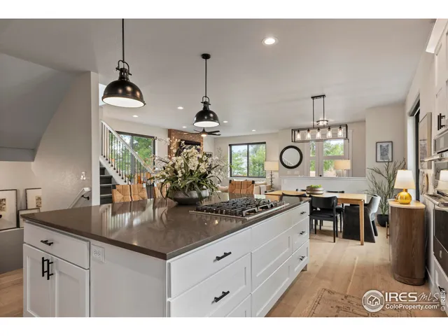 a kitchen with a counter space appliances and living room