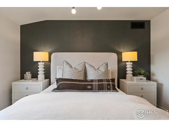 a bathroom with a sink a toilet a mirror and shower