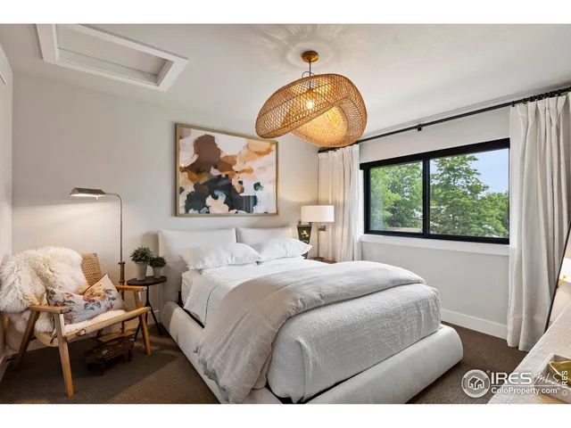 a view of a dining room with furniture and window