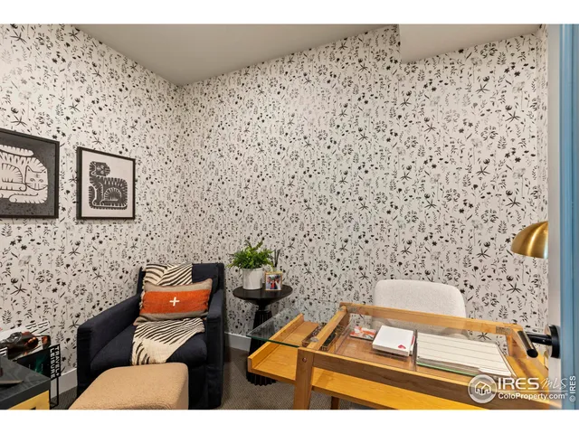 a bedroom with furniture and wooden floor