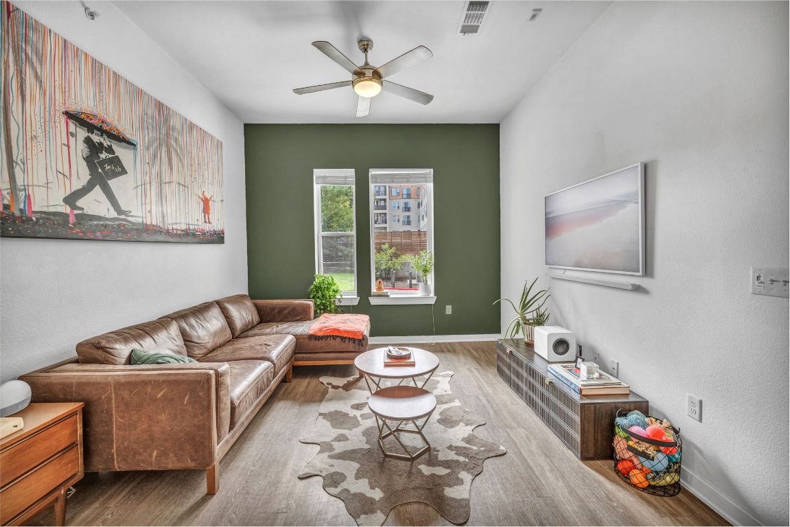 1900 Barton Springs Road, Unit 1036 Austin, TX 78704 - Photo 1 of 26 a living room with furniture and a large window