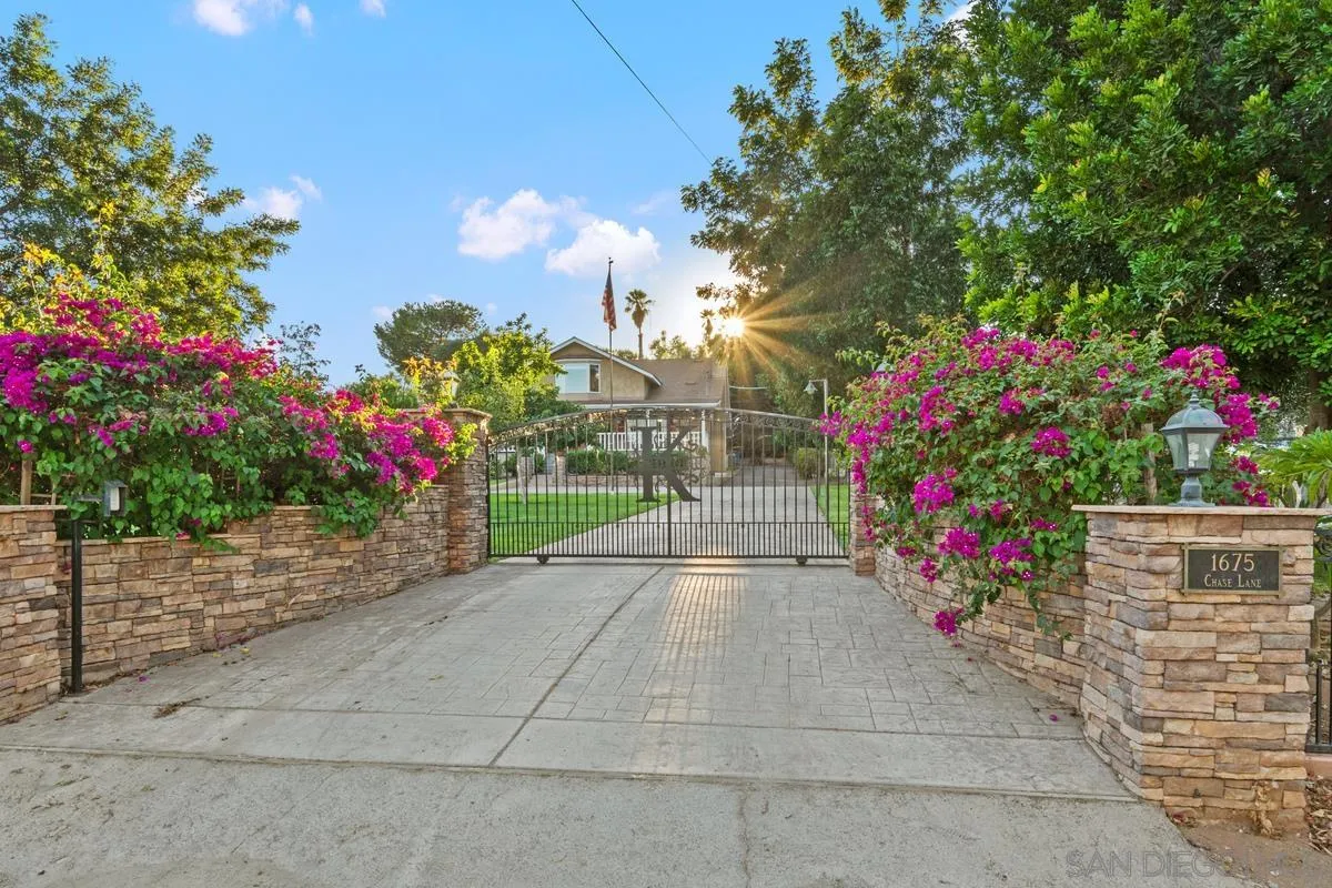 1675 Chase Lane El Cajon, CA 92020 - Photo 1 of 32 a view of a backyard with flowers and flowers