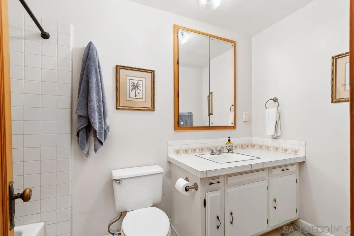 1675 Chase Lane El Cajon, CA 92020 - Photo 17 of 32 a bathroom with a sink vanity and toilet