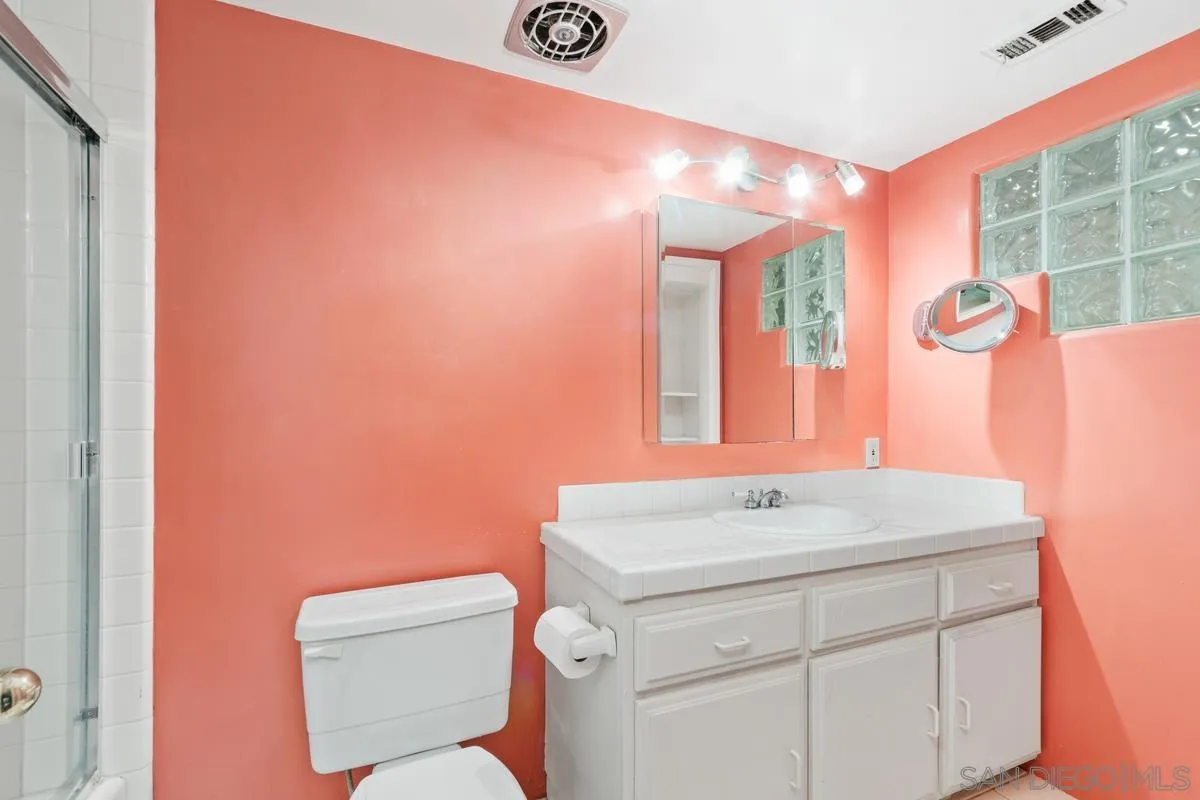 1675 Chase Lane El Cajon, CA 92020 - Photo 22 of 32 a bathroom with a sink and a mirror