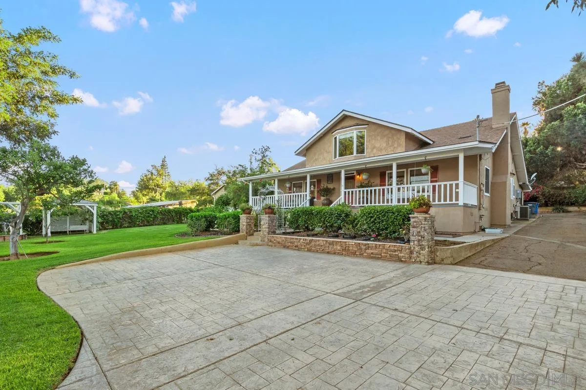 1675 Chase Lane El Cajon, CA 92020 - Photo 3 of 32 a front view of a house with a yard and potted plants