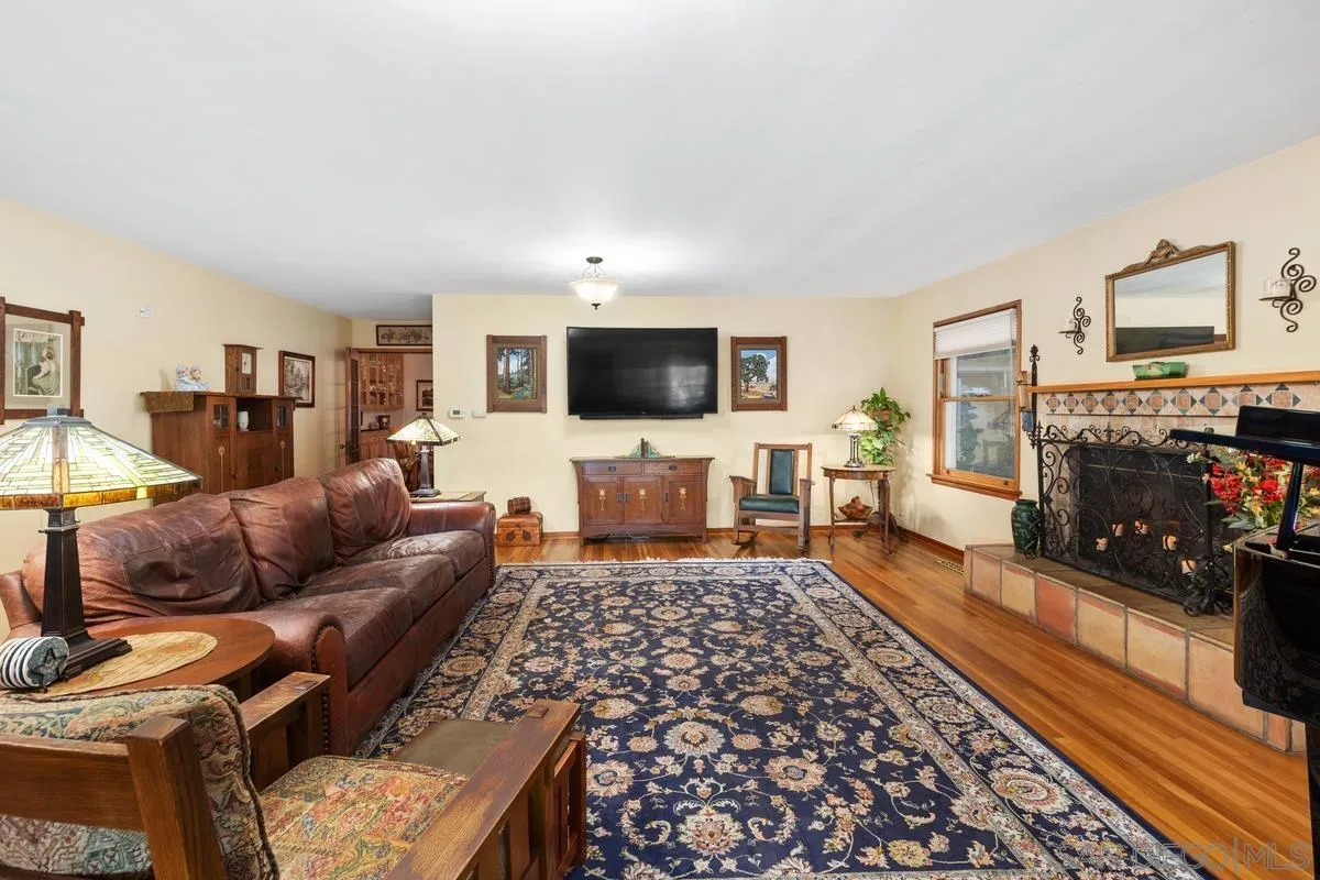 1675 Chase Lane El Cajon, CA 92020 - Photo 4 of 32 a living room with furniture and a flat screen tv
