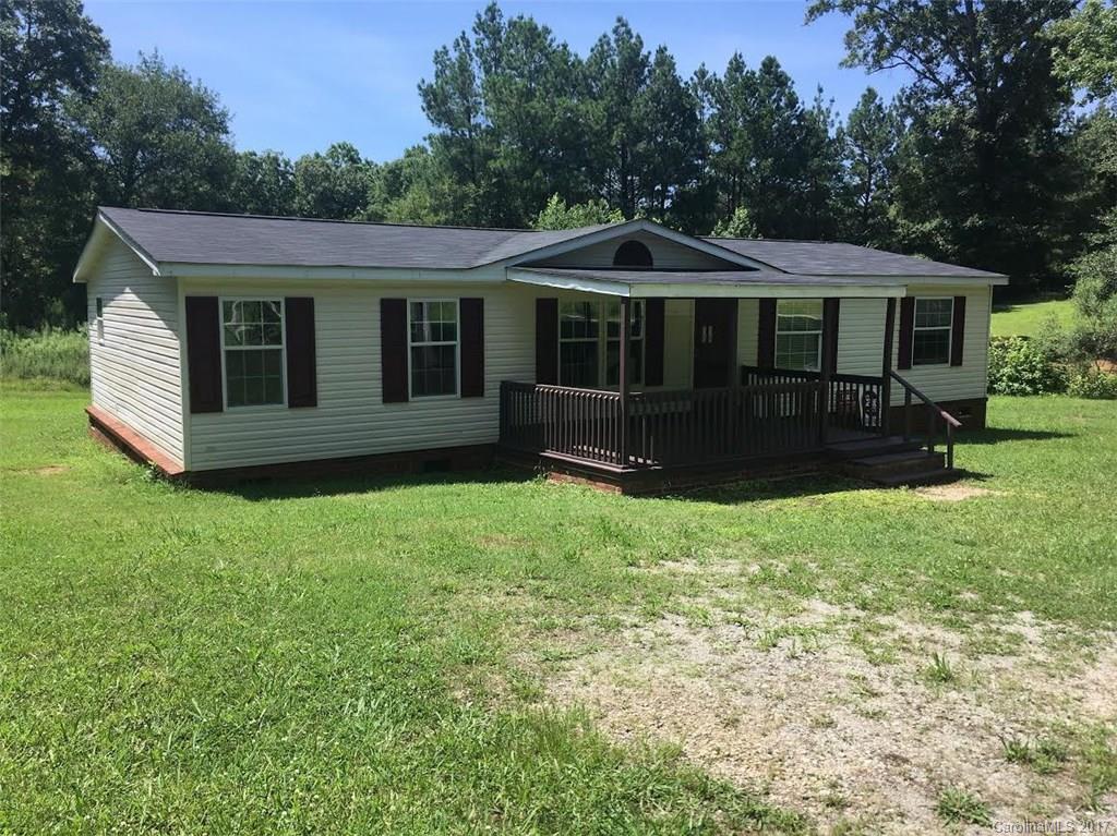 1758 Millen Road Chester, SC 29706 - Photo 1 of 11 a front view of a house with a garden