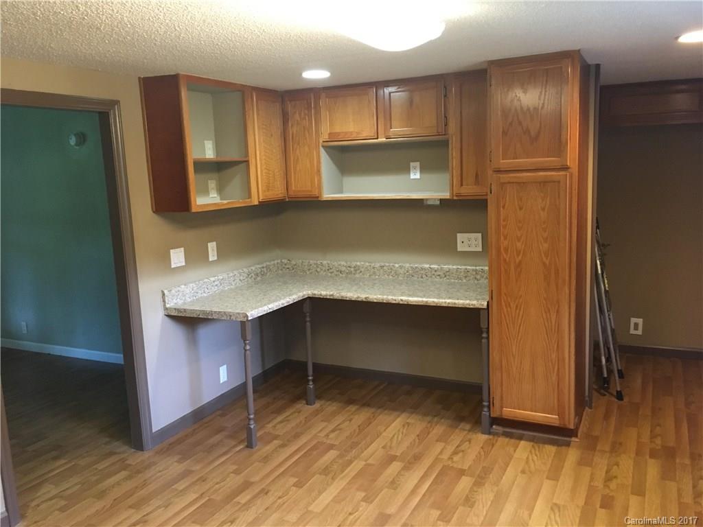 1758 Millen Road Chester, SC 29706 - Photo 5 of 11 a kitchen with kitchen island a sink appliances and cabinets