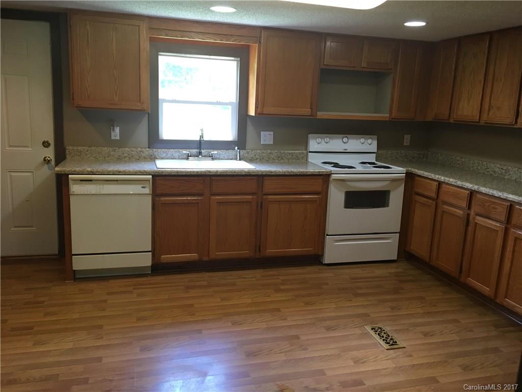 1758 Millen Road Chester, SC 29706 - Photo 6 of 11 a kitchen with a sink cabinets appliances and a window