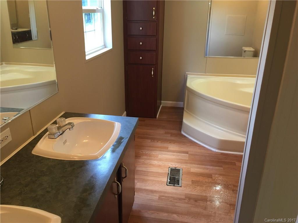 1758 Millen Road Chester, SC 29706 - Photo 8 of 11 a bathroom with a sink and a bathtub
